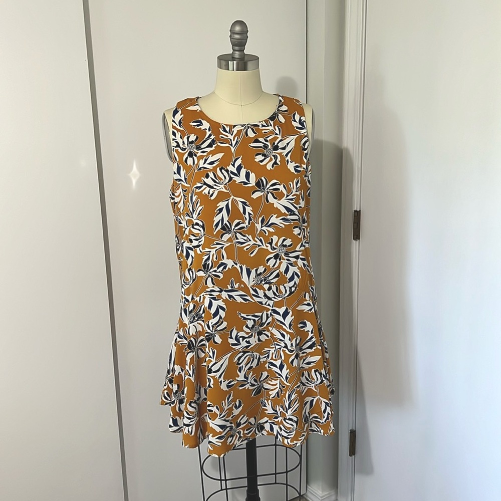 Short sleeveless orange dress with white/blue/black floral design, lined